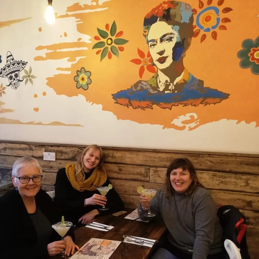 Friends sharing house margaritas at Frida Camden — Mexican restaurant Camden High Street London